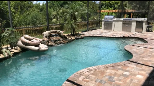 Custom paver patio surrounding a Florida pool